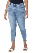 Load image into Gallery viewer, One of Liverpool's signature crop jeans, the Abby Skinny is known for the wonderful fit and recovery, preventing baggy jeans at the end of the day. With a slight fray hem detailing at the bottom of the legs, the Abby is not only comfortable but also stylish. Color-Emmett. 27” Inseam. Mid-rise. Fray hem detail. Amazing stretch and recovery.