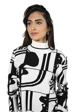 Load image into Gallery viewer, We are in love with this black and off-white contrast abstract design sweater. As unique as it is beautiful, you will receive numerous compliments when you wear this fabulous style. Perfect color combination to essentially pair with any of your favorite bottoms.