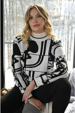 Load image into Gallery viewer, We are in love with this black and off-white contrast abstract design sweater. As unique as it is beautiful, you will receive numerous compliments when you wear this fabulous style. Perfect color combination to essentially pair with any of your favorite bottoms.