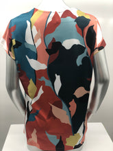 Load image into Gallery viewer, Vivid colors of rust, pear green, teal, orange, peach light blue, black and white come together to create a magnificent abstract print on this gorgeous Paula top. Made with a fabrication meant to keep you cool in those humid days, this will become one of your new favorites. Our Paula top goes well with your favorite solid color bottoms in the same colors or pair with a jean and denim jacket and you're in style and ready for the day!