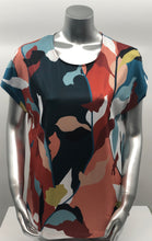 Load image into Gallery viewer, Vivid colors of rust, pear green, teal, orange, peach light blue, black and white come together to create a magnificent abstract print on this gorgeous Paula top. Made with a fabrication meant to keep you cool in those humid days, this will become one of your new favorites. Our Paula top goes well with your favorite solid color bottoms in the same colors or pair with a jean and denim jacket and you're in style and ready for the day!