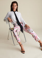 Load image into Gallery viewer, How stunning is this Lydia pant by Joseph Ribkoff? A unique blend of abstract stripes in colors of pink, peach, black and taupe playfully sit on a white background. A gorgeous slimming, stretch fit allows for easy movement and comfort that will last throughout the day. Pair with a solid black or white top to create a fashionable look that will get you noticed!