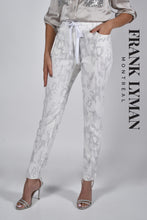 Load image into Gallery viewer, A true beauty, the Cora pant by Frank Lyman is not only fashionable but has such a beautiful feel. A pull on with a drawstring, the subtle animal print in light gray sits atop a white background. Pair with a white tee or a silver/gray top and you will be able to conquer the day in comfort!