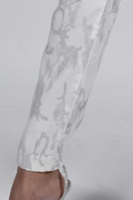 Load image into Gallery viewer, A true beauty, the Cora pant by Frank Lyman is not only fashionable but has such a beautiful feel. A pull on with a drawstring, the subtle animal print in light gray sits atop a white background. Pair with a white tee or a silver/gray top and you will be able to conquer the day in comfort!