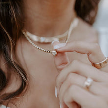 Load image into Gallery viewer, How stunning is this bezel set cubic zirconia heart necklace? A perfect piece to wear on its own or layer together with other favorites for an even more fashionable look.