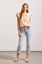 Load image into Gallery viewer, ur Silvia is a super stylish and undeniably comfortable straight-leg jean with a mid-rise fit. The stand-out feature are the side slits at the hem emphasized with embroidered light orange and bright pink detailing. A perfect jean that goes with so many tops including our Farah Flutter Sleeve Textured Blouse with Tassels by Tribal (pictured) Color - Coastline; Light blue. Side slits with embroidery in light orange and bright pink. Mid-rise. Zipper and button closure. Functional front and back pockets.