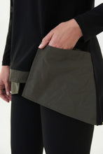 Load image into Gallery viewer, Make a beautiful statement when you style this standout avocado and black cowl neck tunic. The pronounced pockets add eye-catching detail while the cowl neck, in the same fabric as the pockets, add a touch of dramatic flair.