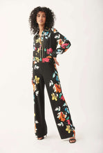 Load image into Gallery viewer, The Nalini floral pants from Joseph Ribkoff epitomize both comfort and style. Adorned with a vivid and lively floral design, these wide-leg pants are bound to garner admiration. The Nova features an easy pull-on design and an elastic waistband for supreme comfort. Its smooth, silky knit material offers a touch of luxury.