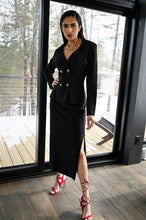 Load image into Gallery viewer, Our black knit long skirt by Frank Lyman is a gorgeous addition to your wardrobe as it pairs perfectly with a number of tops. A classic piece, our Bristol skirt is a flattering style with a side slit, giving it a sophisticated feel.