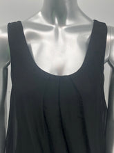 Load image into Gallery viewer, You need look no further for the perfect black sleeveless top because our Clea is the one! A beautiful sheer flowy fabrication on the outside with a knit tank inside gives this style a perfect flair. Black goes well with everything in your closet and this black top will pair beautifully with everything in your closet.