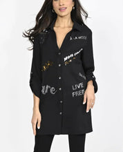 Load image into Gallery viewer, Such an amazing top, our Britta is a sophisticated tunic length woven knit top with wording that pops against the black background. Shiny sequins and lettering reflect the light and get you noticed! Pairs beautifully with black leggings, providing a very stylish and chic look. Color- Black. Sequin and shiny lettering. Crystal buttons. Tab roll sleeves. Words such as "Live Free" "Mon Coeur" (My heart) "A La Mode" "Amore" and more.
