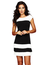 Load image into Gallery viewer, Classic black and ivory is always a chic color combination and our Idina knit dress is a perfect combination of the two colors. The Idina is one of Frank Lyman's signature designer styles. With flattering pleated hemlines and color blocking, it is so easy to see why this is one of Lyman's finest designs.