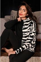 Load image into Gallery viewer, Black and white contrast with half zebra pattern, creates a chic and sophisticated sweater by Frank Lyman. This modish style pairs beautifully with almost any bottom. Prepare to receive many compliments when you wear this cozy, fashionable sweater. Color- Black and white. Half solid, half zebra print. High neck. Pull-over. Cozy.
