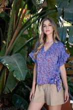 Load image into Gallery viewer, A beautiful wrap style bodice with a side tie and ruffle sleeve creates a classic silhouette on our Marissa top. Add the rich blue color with a brown animal print, and it is a classic piece with pizzazz! Dress up or down with this very versatile top!
