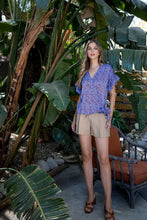 Load image into Gallery viewer, A beautiful wrap style bodice with a side tie and ruffle sleeve creates a classic silhouette on our Marissa top. Add the rich blue color with a brown animal print, and it is a classic piece with pizzazz! Dress up or down with this very versatile top!