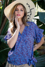 Load image into Gallery viewer, A beautiful wrap style bodice with a side tie and ruffle sleeve creates a classic silhouette on our Marissa top. Add the rich blue color with a brown animal print, and it is a classic piece with pizzazz! Dress up or down with this very versatile top!