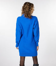 Load image into Gallery viewer, A piercing bright blue color dazzles on this mesmerizing Bettina dress. The classic cable pattern and ribbed cuffs, along with a slightly oversized fit, creates a style that will become your next fashion favorite. Our Bettina is a beautiful piece to style with leggings and boots or choose to wear alone with boots or heels. Color- Blue. Pull-over style. Mock-neck. Ribbed cuffs.