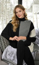 Load image into Gallery viewer, A gorgeous and stylish sweater, our Charisma with color blocking in off-white and black along with a panel of houndstooth, is an incomparable fashion design. Our sweater is designed with dolman sleeves and includes a flattering, generous cut. Color- Black, off-white. Unlined. Dolman sleeve. Approximately 30 inches long, with a 24 inch sleeve.