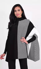 Load image into Gallery viewer, A gorgeous and stylish sweater, our Charisma with color blocking in off-white and black along with a panel of houndstooth, is an incomparable fashion design. Our sweater is designed with dolman sleeves and includes a flattering, generous cut. Color- Black, off-white. Unlined. Dolman sleeve. Approximately 30 inches long, with a 24 inch sleeve.