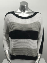 Load image into Gallery viewer, For those cool summer nights, or Caryl sweater is the perfect piece to keep warm. Not too heavy and not too light, this knit sweater is fashionable and functional. The colorblock colors in white, gray and black are so on trend and literally goes with so many different bottoms. As this 3/4 sleeve sweater is not a tight knit, it is slightly see-through. Wear over a bralette, tank or nude bra if preferred.