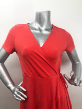 Load image into Gallery viewer, Look absolutely stunning in this vibrant red-orange modal dress by Mimi K. The Willow dress, made of Modal fabric, is lightweight, stretchy, and breathable and doesn't wrinkle easy, making it a travel worthy piece. Willow has a look of a wrap dress but is actually one piece with a tie on the side.