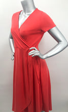 Load image into Gallery viewer, Look absolutely stunning in this vibrant red-orange modal dress by Mimi K. The Willow dress, made of Modal fabric, is lightweight, stretchy, and breathable and doesn't wrinkle easy, making it a travel worthy piece. Willow has a look of a wrap dress but is actually one piece with a tie on the side.