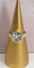 Load image into Gallery viewer, Sparkle galore describes this fabulous square cut cubic zirconia ring. A brilliant gold band with a unique finish, adds to the beauty. A ring for all occasions, this statement piece will definitely get noticed!
