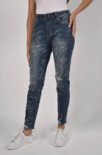 Load image into Gallery viewer, This stylish jean features tasteful embellishments and strategic distressing, resulting in a trendy yet refined appearance. French text and scattered crystals add a touch of visual interest, while subtle distressing at the knee and ankles provides a subtle hint of edge.