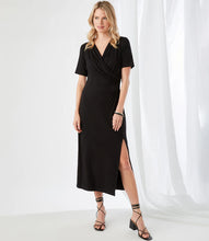Load image into Gallery viewer, Simply elegant and classy is our Alicia Faux Wrap Midi Dress by Karen Kane. A perfect evening-ready midi dress is designed and made from fluid jersey-knit fabric that offers an eye-appealing draping. A side-slit on the left side offers an even greater interest in this gorgeous midi dress.