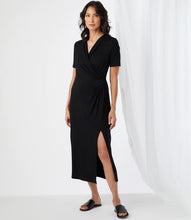 Load image into Gallery viewer, Simply elegant and classy is our Alicia Faux Wrap Midi Dress by Karen Kane. A perfect evening-ready midi dress is designed and made from fluid jersey-knit fabric that offers an eye-appealing draping. A side-slit on the left side offers an even greater interest in this gorgeous midi dress.