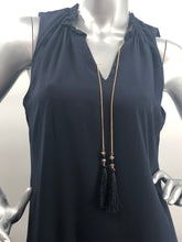 Load image into Gallery viewer, Our Frank Lyman designed Tamela dress is a gorgeous dark navy called Twilight. A perfect alternative to a black dress, this beauty is elevated in design with a detachable necklace in gold, navy and gold beads and twilight navy fringe. Slight ruffle detailing at the neckline as well as the bottom adds even more interest. A gorgeous style for those special events, you will feel beautiful every time you wear this dress.