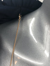 Load image into Gallery viewer, Our Frank Lyman designed Tamela dress is a gorgeous dark navy called Twilight. A perfect alternative to a black dress, this beauty is elevated in design with a detachable necklace in gold, navy and gold beads and twilight navy fringe. Slight ruffle detailing at the neckline as well as the bottom adds even more interest. A gorgeous style for those special events, you will feel beautiful every time you wear this dress.