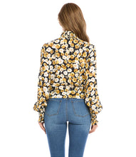 Load image into Gallery viewer, Add a dash of old-world romance to your wardrobe with our Fiona top with smocked sleeves, dramatic collar and tie front. With its unique design, this beautifully unique top can be dressed up or worn casually. You'll be sure to receive compliments when you style this beautiful top. Color-Black, white and gold. Long sleeve with smocked cuff. V-neck with smocked collar.