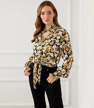 Load image into Gallery viewer, Add a dash of old-world romance to your wardrobe with our Fiona top with smocked sleeves, dramatic collar and tie front. With its unique design, this beautifully unique top can be dressed up or worn casually. You'll be sure to receive compliments when you style this beautiful top. Color-Black, white and gold. Long sleeve with smocked cuff. V-neck with smocked collar.