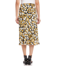 Load image into Gallery viewer, Add a romantic feature to your wardrobe with this floral garden print midi skirt. Our Gia skirt is designed with an easy pull-on silhouette that flows away from the body in streamlined sophistication. For a gorgeous look, pair with our GEORGIA GOLD SATIN LONG SLEEVE BUTTON DOWN SHIRT. Color- Black, white and gold. Floral print Elasticized waistband. Bias cut. Mid-rise Floral print
