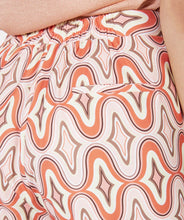 Load image into Gallery viewer, Our Gloria wide leg pant is just "groovy" with its 70's inspired geometric print. These cool pants have side pockets and a blind zipper on the side and have a terrific satin feel. Looks fantastic paired with our BRITTANY BRIGHT PEACH PUFF SLEEVE TOP - ESQUALO and our ODELIA OFF-WHITE BLOUSON SLEEVE T-SHIRT - ESQUALO. Color - Groovy; Coral, peach, off white, light brown, light yellow. Geometric print. Lined. Satin feel fabric. Not a stretch fabrication. Side zipper closure. Wide leg design.