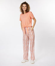 Load image into Gallery viewer, Our Gloria wide leg pant is just "groovy" with its 70's inspired geometric print. These cool pants have side pockets and a blind zipper on the side and have a terrific satin feel. Looks fantastic paired with our BRITTANY BRIGHT PEACH PUFF SLEEVE TOP - ESQUALO and our ODELIA OFF-WHITE BLOUSON SLEEVE T-SHIRT - ESQUALO. Color - Groovy; Coral, peach, off white, light brown, light yellow. Geometric print. Lined. Satin feel fabric. Not a stretch fabrication. Side zipper closure. Wide leg design.