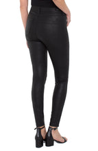 Load image into Gallery viewer, The signature Madonna legging in a black coated knit offers a classic look with a bit of edge with its subtle shine! Unique and classy, these leggings will look stunning paired with any top. Incredible comfort, the Madonna legging fits true to size, stretches with every movement but has fabulous recovery and does not end up bagging. Stand out in a crowd with these attention-grabbing leggings! You will not be disappointed! Color- Black. 29'' Inseam. Hi-rise.