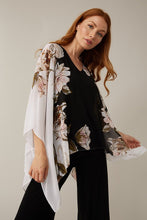 Load image into Gallery viewer, Stunning in all ways, this gorgeous, flowy cape sleeve top by Joseph Ribkoff is definitely a head turner. Black, white, pink, and olive colors come together in a floral print to create a lovely top that easily can we worn all year long. Colors-Black, white, pink, olive green. Cape sleeve. Flowy material lays over a black tank lining. V-neck.