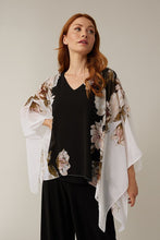 Load image into Gallery viewer, Stunning in all ways, this gorgeous, flowy cape sleeve top by Joseph Ribkoff is definitely a head turner. Black, white, pink, and olive colors come together in a floral print to create a lovely top that easily can we worn all year long. Colors-Black, white, pink, olive green. Cape sleeve. Flowy material lays over a black tank lining. V-neck.