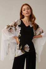 Load image into Gallery viewer, Stunning in all ways, this gorgeous, flowy cape sleeve top by Joseph Ribkoff is definitely a head turner. Black, white, pink, and olive colors come together in a floral print to create a lovely top that easily can we worn all year long. Colors-Black, white, pink, olive green. Cape sleeve. Flowy material lays over a black tank lining. V-neck.