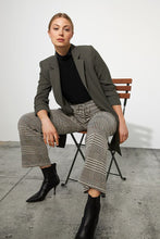 Load image into Gallery viewer, Preppy printed jacquard gets an athleisure-inspired refresh with the addition of a charming tie front with belt loops. A light dusting of gold sparkle thread elevates this fashionable pant. Comfortable and chic, this pant is the best of both worlds. Pairs perfectly with our BIANCA BEIGE AND BLACK KNIT JACKET- JOSEPH RIBKOFF 223298 Color- Beige, black, gold and just hints of yellow and dark orange. Elastic waist. Drawstring. Belt loops and self-tie.