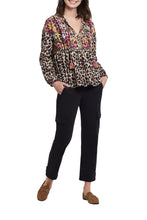 Load image into Gallery viewer, A colorful and fun pattern print comes alive on this dolman sleeve blouse. A bold abstract print combines with a leopard print to create a uniquely beautiful design. The Trisha long sleeve blouse is a perfect top to dress up or wear casually with jeans. Any way you decide to style this gorgeous top, you will definitely stand out as a fashionista! Color- Taupe grey, pinks, gold, red. Dolman sleeve. Self-tie at neck. Multi print. Pop-over notch neck with tassel trim. Flowy fit.