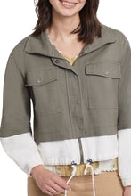 Load image into Gallery viewer, If you are searching for a jacket with a fresh take on a simple style, our Meriam jacket in moss green is the jacket for you! With so many interesting details- hidden zippered placket, adjustable draw cord hem, stand up collar, drop shoulder sleeves with elastic cuffs and chest patch pockets, this winning jacket will get you noticed! In addition, you are going to love the super soft cotton twill fabric. Pair with our MECA LIGHTWEIGHT MOSS GREEN MESH TURTLENECK for the perfect look!