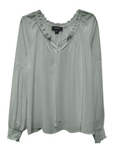 Load image into Gallery viewer, A romantic long sleeve ruffle blouse with tie front is a beautiful style to elevate any outfit. This pulled-together staple is a breezy yet tailored silhouette with a flirty ruffled split neck and tie front. Slight billowy lower arms meet at elasticized cuffs. Dress up with your favorite bottom or dress casually with your favorite jean. Color- Slate. Ruffle split neck. Tie front. Slight billowy arms.