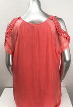 Load image into Gallery viewer, A vibrant coral color really pops on this flowy, beautiful Casey Coral Top by M Made In Italy. The design details are spectacular with crochet split short sleeves. The flowy fabric on the outside of a solid tank offers a feminine touch. A little drama, a little romance, this solid hue pairs perfectly with almost everything in your closet.