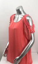 Load image into Gallery viewer, A vibrant coral color really pops on this flowy, beautiful Casey Coral Top by M Made In Italy. The design details are spectacular with crochet split short sleeves. The flowy fabric on the outside of a solid tank offers a feminine touch. A little drama, a little romance, this solid hue pairs perfectly with almost everything in your closet.
