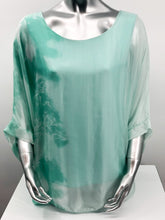 Load image into Gallery viewer, Imagine wearing this incredible top at an outdoor party or out to dinner with friends. A glorious flowy fabrication creates a stunning tunic in a mint tie dye pattern. Create a classy and fashion forward look with this tunic by pairing it with white bottoms or black slacks.