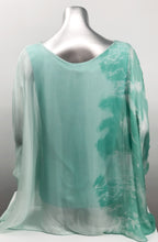 Load image into Gallery viewer, Imagine wearing this incredible top at an outdoor party or out to dinner with friends. A glorious flowy fabrication creates a stunning tunic in a mint tie dye pattern. Create a classy and fashion forward look with this tunic by pairing it with white bottoms or black slacks.