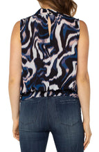 Load image into Gallery viewer, This beautiful floating ink printed top in nautical blue, black, white and soft pink is a fabulous statement piece featuring a mock neck slit and smocked waistband. With a great fit, providing all day comfort, our Mandi can be worn alone or under your favorite jacket or blazer. An outstanding outfit includes this top paired with your favorite white bottom. Color- Floating Ink; Blue, black, white and soft pink. Split front. Sleeveless. Banded elastic bottom. Blousy design. Not stretch fabrication.